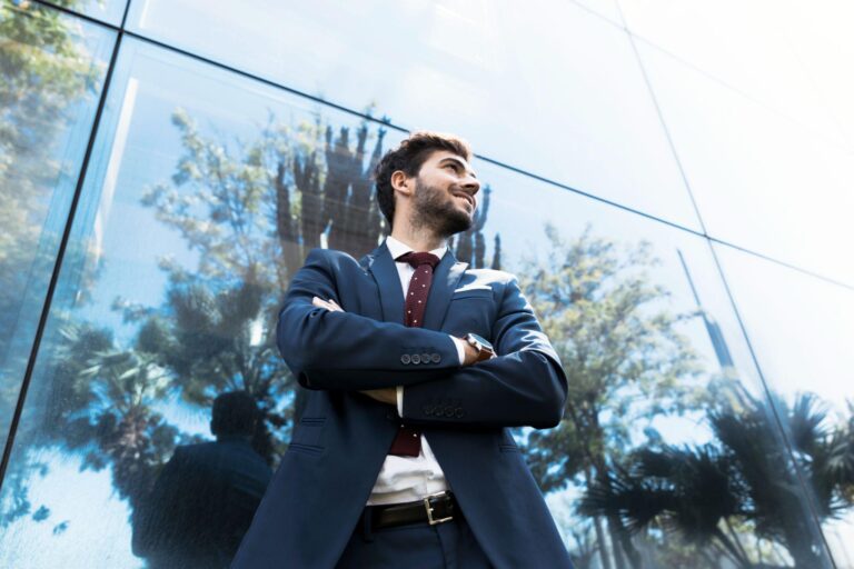A confident man standing with arms crossed