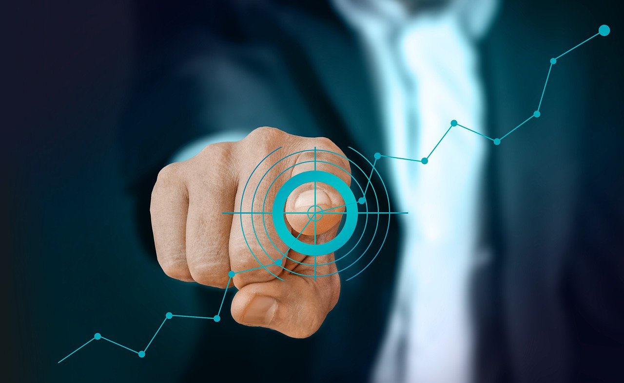 A person pointing at a rising growth line