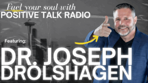 Edit the attached podcast screenshot without changing the people, their expressions, the layout, or the overall appearance. Keep the original image exactly as it is. Add a clean, modern banner at the top with a dark navy blue background and white text. The text should read: FEATURED PODCAST "Get Out of the Way of the Growth You Desire" Host: Vicki Noethling Guest: Dr. Joseph Drolshagen At the bottom of the image, add: Learn more: www.JosephADrolshagen.com⁠� Use elegant fonts such as Montserrat or Poppins. Make the title bold and prominent. Keep the design professional, premium, and suitable for LinkedIn, Facebook, and Instagram. Do not crop, blur, replace, or modify the podcast screenshot. Only add the text and subtle design elements that complement the existing image while preserving the original broadcast.